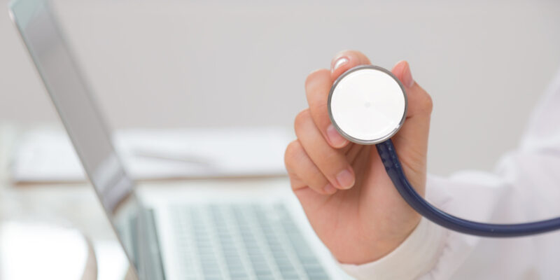 Doctor with stethoscope in the hands