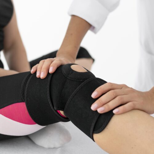 physiotherapist-helping-female-patient-her-clinic