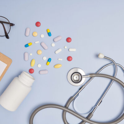 Stethoscope, a pen and a blank prescription pad.  Medicine or pharmacy concept. Empty medical form ready to be used. Modern medical Information technology.